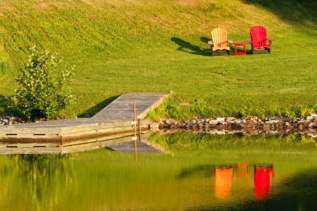 Two wooden chairs on lawnの写真素材