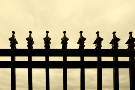 Black wrought-iron fenceの写真素材