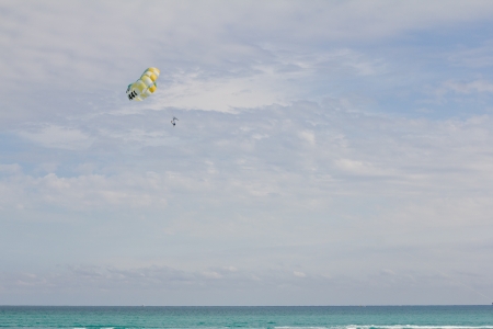 parachute sailing  over the oceanの写真素材