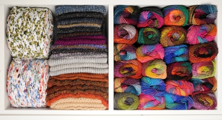 Shelf with colorful wool and scarvesの写真素材