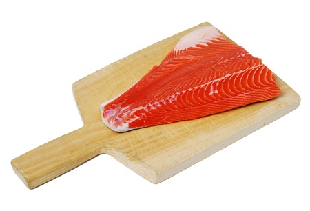 Raw salon filet on a wooden cutting boardの写真素材