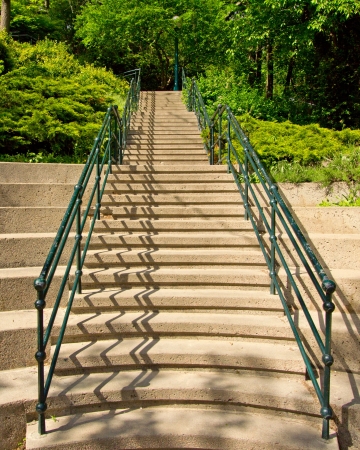 Stairs with green railing