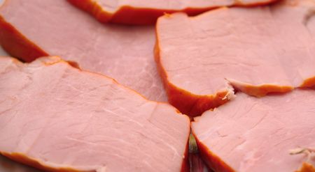 Close up of the pork meat slices. Background.