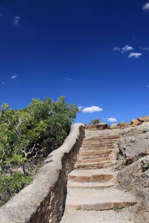 Old stone stairs. Blue sky.の写真素材