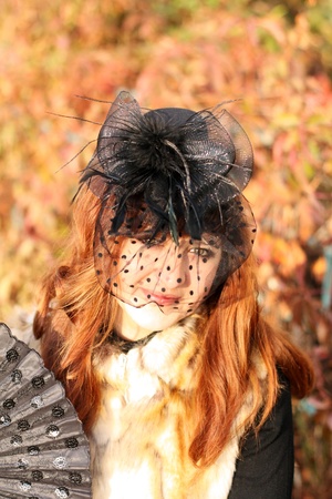 Portrait of the lady in fancy black hat with feathers and veilの写真素材