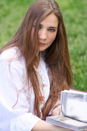 Portrait of the beautiful ukrainian girl with bookの写真素材