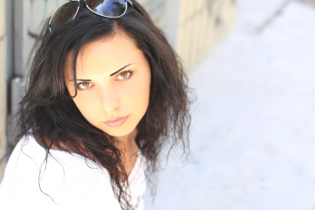 Portrait of the beautiful brunette woman. Glare.の写真素材