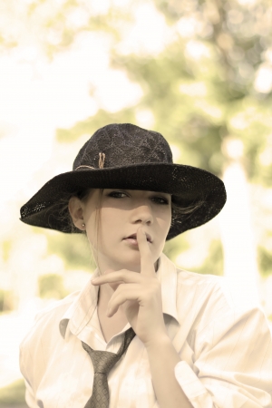 Portrait of the beautiful woman wearing black hatの写真素材