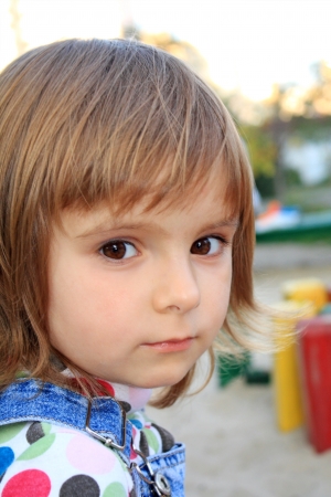 Portrait of the little pretty serious girlの写真素材