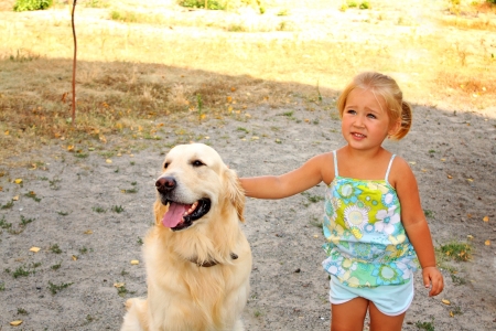 Portrait of the little girl with  the big dogの写真素材