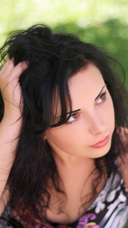 Outdoors summer portrait of the young beautiful womanの写真素材