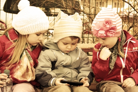 Outdoors portrait of three lovely kidsの写真素材