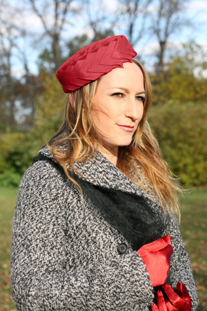 Lady in red hatの写真素材