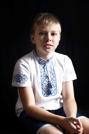 Portrait of the Ukrainian boy wearing traditional vyshyvanka shirtの写真素材