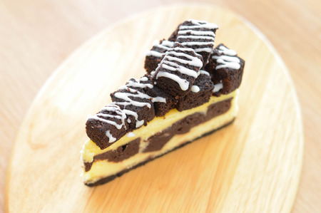 Brownie and cheesecake on wooden table.の写真素材
