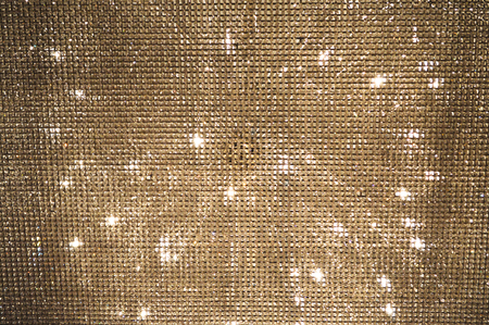 Golden background mosaic with light spots.