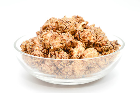 Premium packshots of chocolate popcorn in white Bowl on white background.の写真素材