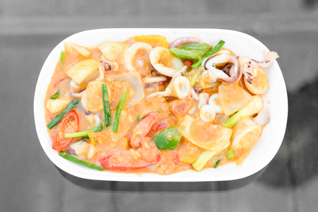 Stir Fried squid with salted egg york. Thai Food.の写真素材