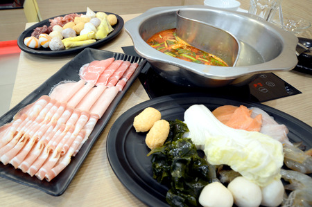 Taiwanese Shabu Buffet, Served in a hot pot style, Pork slices and meat ball for hot pot and shabu served. soft focus.の写真素材