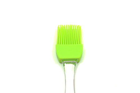 Green silicon pastry kitchen brush on white background. copy space.の写真素材
