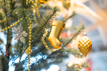 Closeup of Golden and silver tone bauble decorated Christmas tree.の写真素材