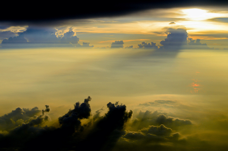 Sunset sky and sea from the airplane window.の写真素材