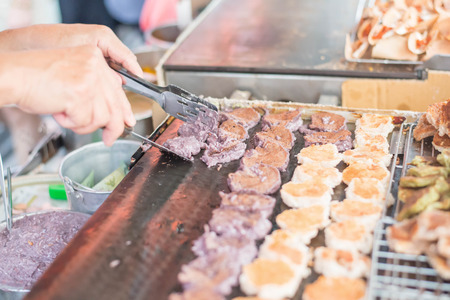 Cooking for Thai coconut mix with powder fried dessert. Coconut pancake. Thai Snack.の写真素材