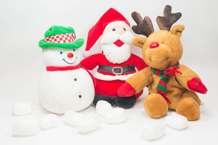 Reindeer doll and Santa doll with snowman doll on white background.の写真素材