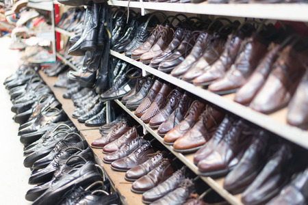 Shop of second hand leather shoes. Many used shoes for sale.の写真素材