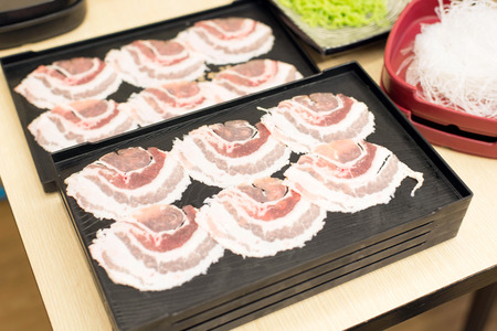 Pork slide in the black tray.の写真素材