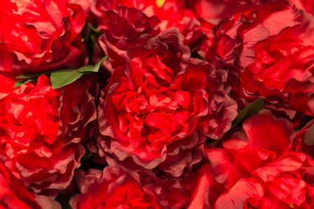 Bouquet of red artificial flowers for background.の写真素材