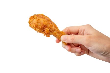 Hand hold fried chicken on white background.の写真素材