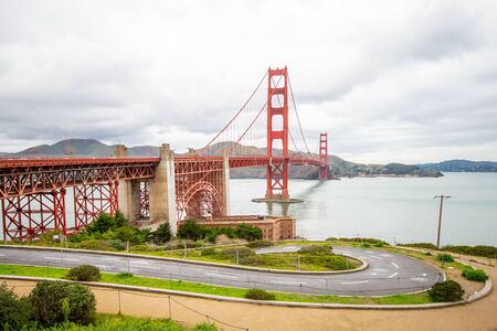Landscape view of the Golden Gate Bridge on a beautiful cloudy day.