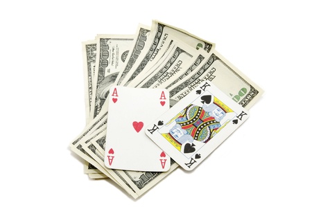 Dollars and playing cards on white composition