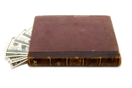 in an old book hidden dollars on white backgroundの写真素材