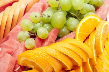 sliced juicy ripe fruit in a restaurantの写真素材