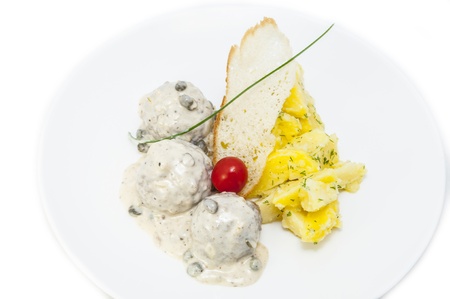 meatballs with potatoes on the table in a restaurantの写真素材