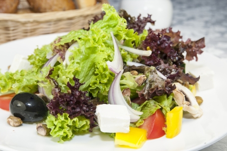 Greek salad on a table in a restaurantの写真素材