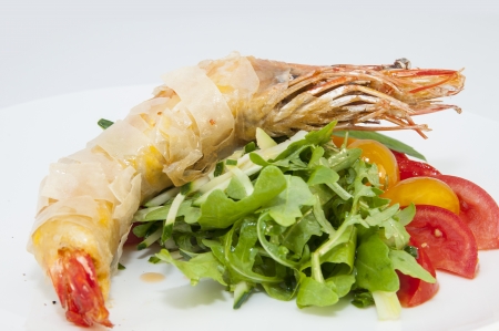jumbo shrimp with herbs and several types of tomatoesの写真素材