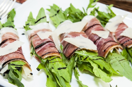 rolls with meat and greens on a table in a restauraの写真素材