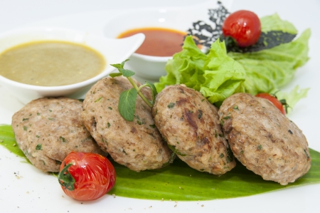 vegetarian meatballs with salad on a white background in restaurantの写真素材