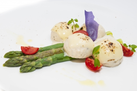 meatballs with asparagus on a white background in the restaurantの写真素材