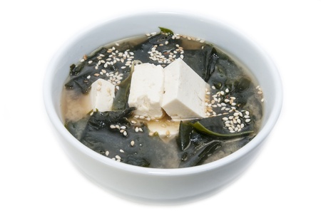 Japanese soup with herbs and cheese on white backgroundの写真素材