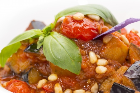 salad of steamed zucchini on a white dish at restaurantの写真素材