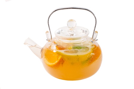glass teapot with orange teaの写真素材