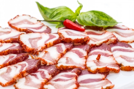 bacon, onion and pepper on a plate in a restaurantの写真素材