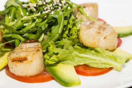 scallops grilled with avocado and tomatoesの写真素材