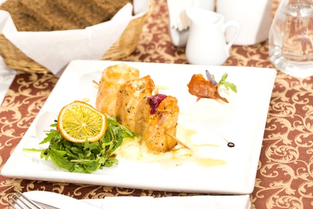 baked salmon rolls on a table in a restaurant