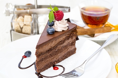 piece of chocolate cake on a table in a restaurant