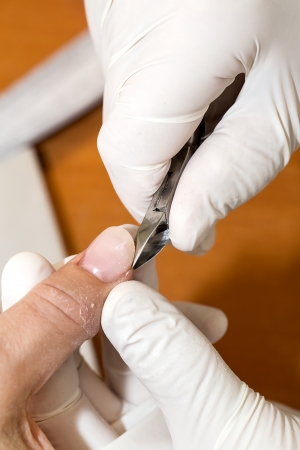processes work on a manicure in the salonの写真素材